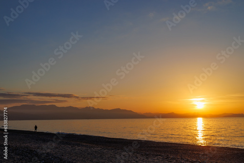 Fototapeta Naklejka Na Ścianę i Meble -  Sunset on the beach in Cefalu on the island of Sicily