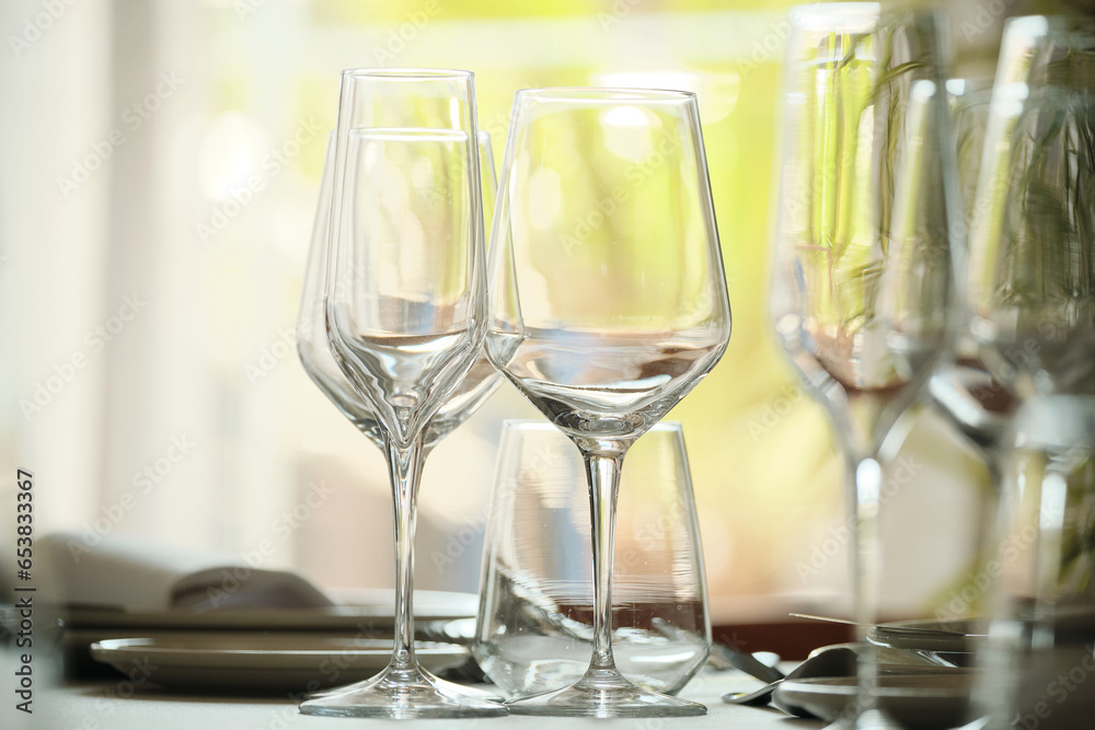 Captured radiance: The sparkling reflections in these crystal glasses elevate the ambiance of this meticulously arranged wedding banquet. Captured radiance: The sparkling reflections in these crystal glasses elevate the ambiance of this meticulously arranged wedding banquet.