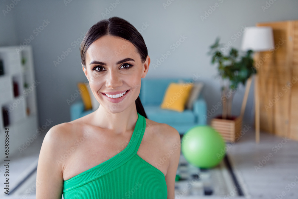Photo of sexy charming lady wear sporty outfit smiling enjoying practicing sport indoors home studio