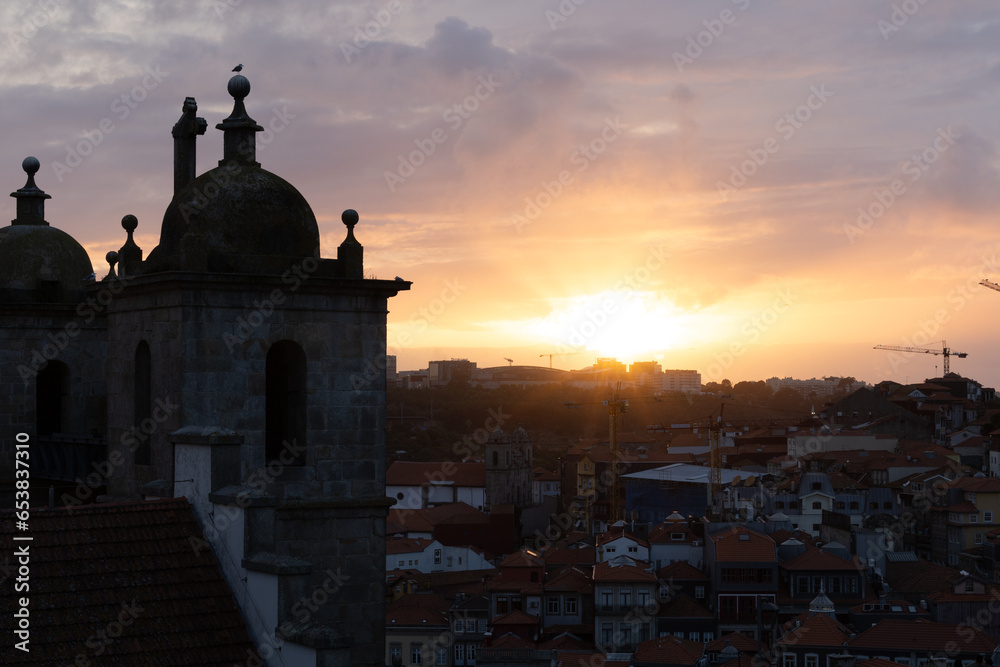 Porto, Portugal A sunset view over the Ribeira district  and chapels belonging to the Porto Cathedral and museum.
