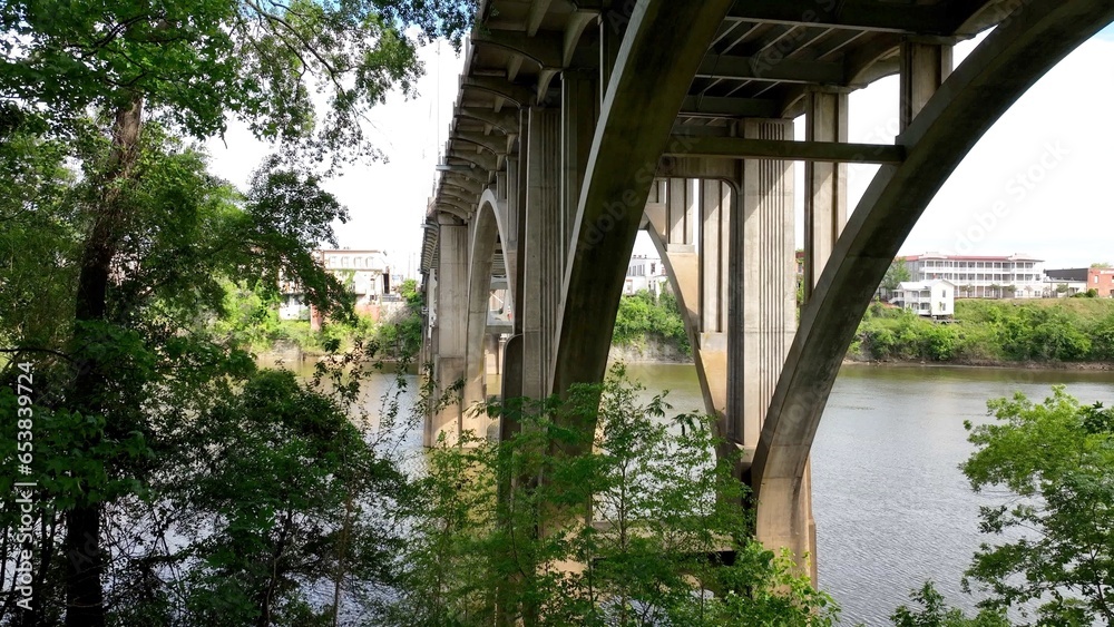 Concrete Bridge architecture with arches beneath the Edmund Pettus Bridge in Selma Alabama crossing the Alabama River in the deep South USA Concrete Bridge architecture with arches beneath the Edmund Pettus Bridge in Selma Alabama crossing the Alabama River in the deep South USA