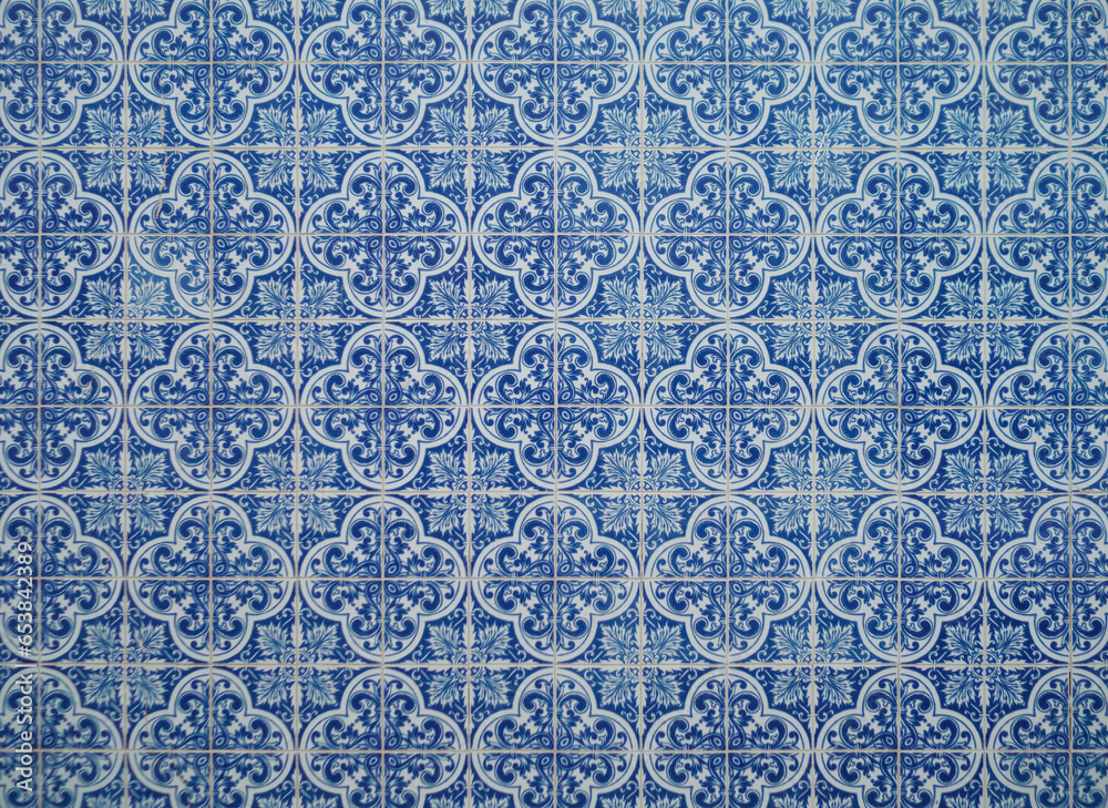 Part of a typical Portuguese wall decorated with tiles. Nice blue and white colors. Portugal. Horizontal photo.