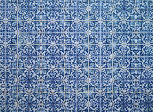 Part of a typical Portuguese wall decorated with tiles. Nice blue and white colors. Portugal. Horizontal photo.