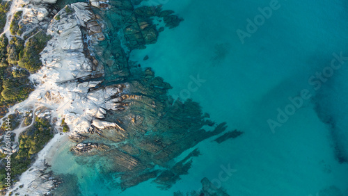 Aerial drone view of rocks, water and forest near the twin beaches of Karidi and small Karidi, Vourvourou, Sithonia peninsula, Halkidiki, North Greece photo