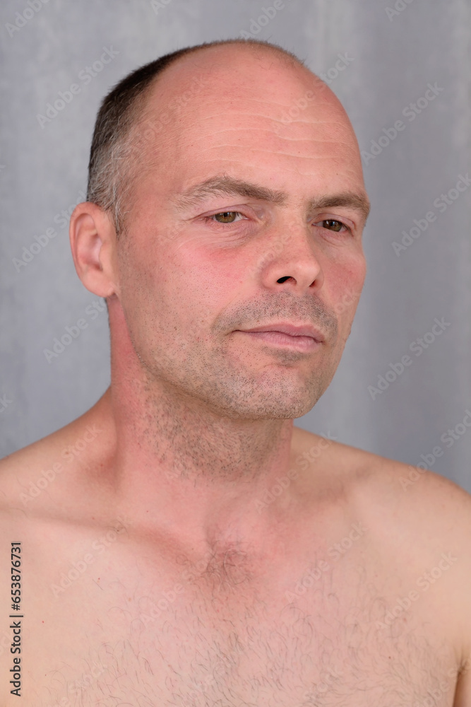 Obraz premium Portrait of a young man with a short haircut