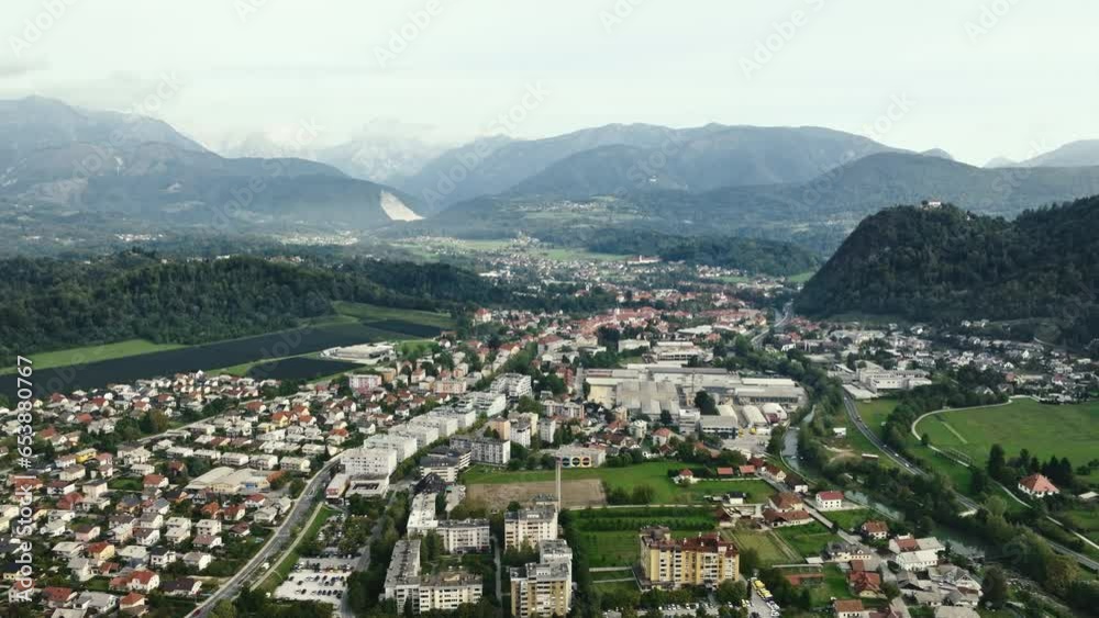 Majestic aerial view of a Slovenian town nestled between imposing mountain ranges. Majestic aerial view of a Slovenian town nestled between imposing mountain ranges.