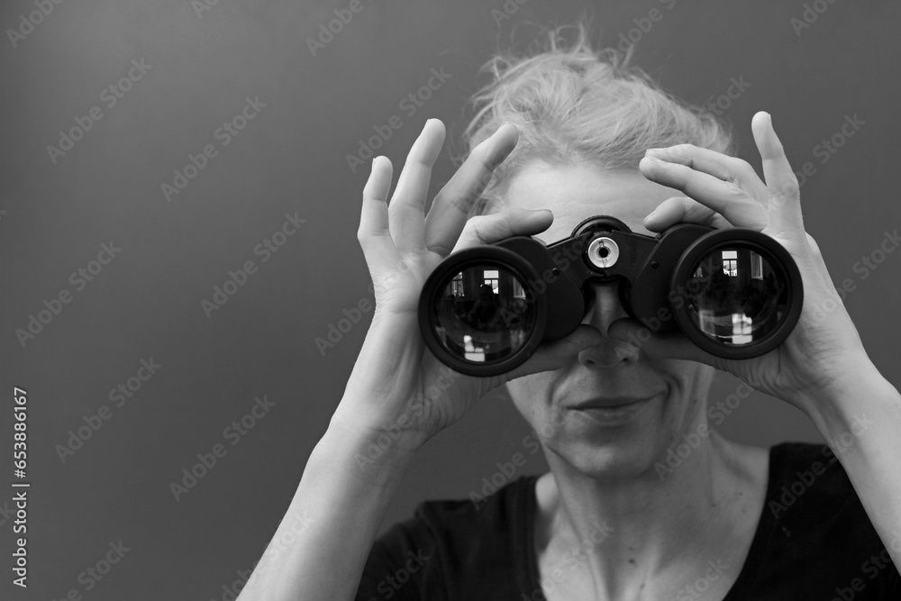 woman looking through binoculars at a sport event with white background with people stock image stock photo woman looking through binoculars at a sport event with white background with people stock image stock photo