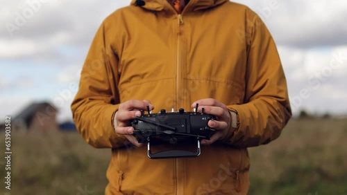 a man use FPV te controller for an airplane or drone