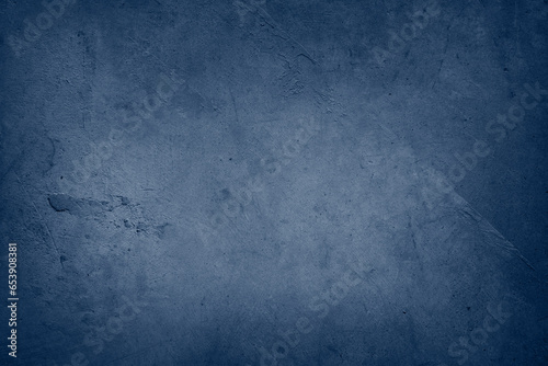 Blue textured concrete wall background. Dark edges
