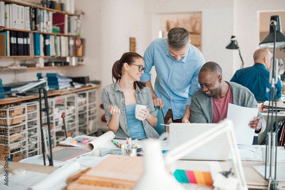 Group of people working together on a project in a startup company office Group of people working together on a project in a startup company office
