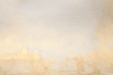 Watercolor paper grain texture painting wall. Abstract gold, nacre and beige marble copy space background.
