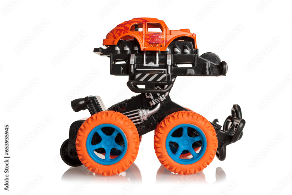 Fototapeta premium Kids toy Bigfoot with big orange wheels isolated on white background