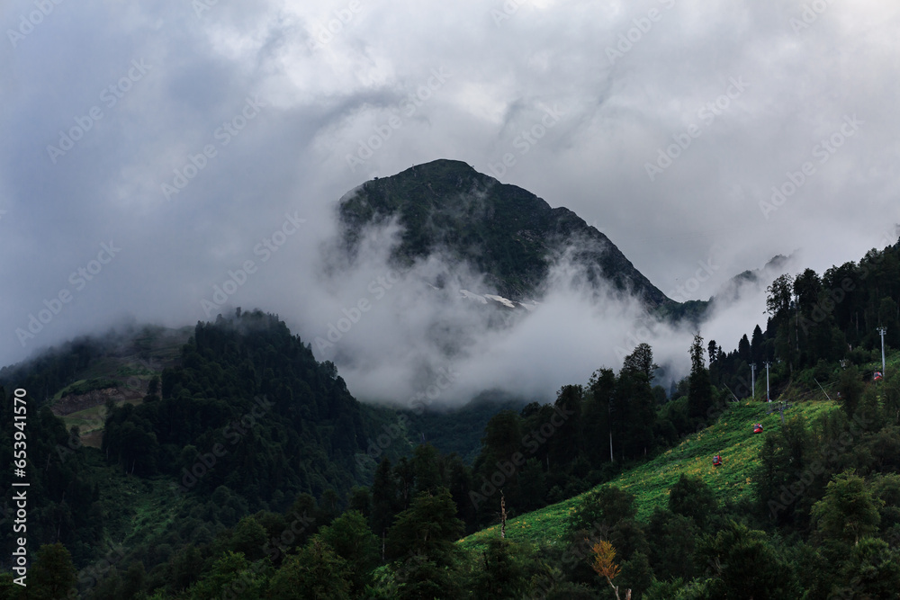 Mountains with green trees, clouds, highlands, Krasnaya Polyana.