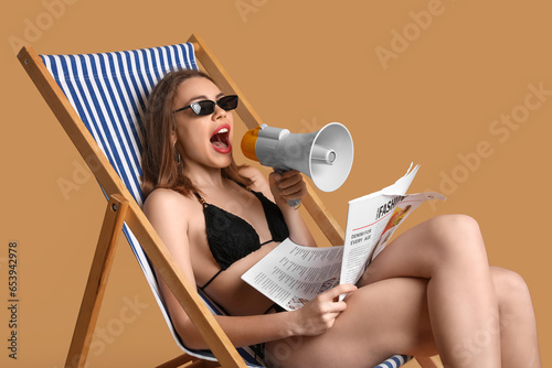 Young woman shouting into m...