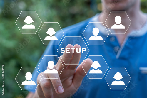 Man using virtual touch interface clicks word: SETUP. Setup Settings Configuration Tools Business Industry Information Technology Concept.