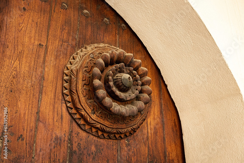 Old wooden door in the Al Shafei mosque seen from Suq Al Jami - Al Mazloum, Al Balad district, Historic Jeddah, Saudi Arabia photo