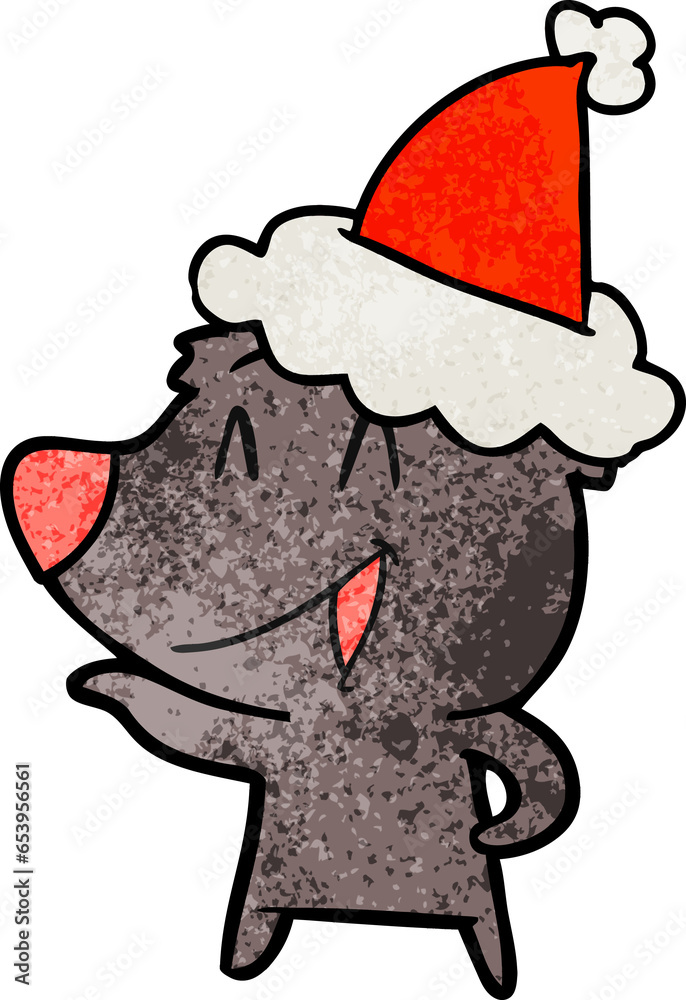 Obraz premium laughing bear hand drawn textured cartoon of a wearing santa hat