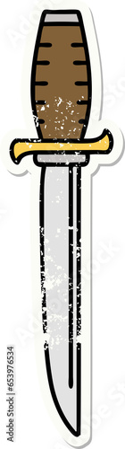 distressed sticker tattoo in traditional style of a dagger