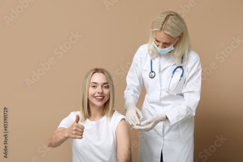 Doctor giving injection to ...