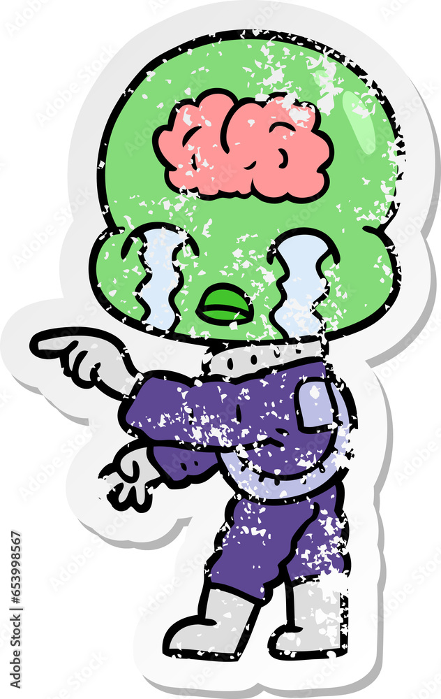 Obraz premium distressed sticker of a cartoon big brain alien crying and pointing