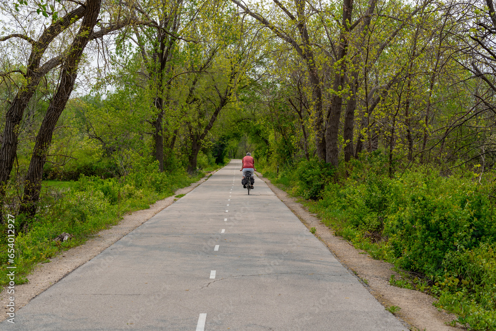 People On Bicycles Enjoying The Fox River Trail Near De Pere, Wisconsin, In Spring