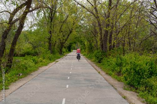 People On Bicycles Enjoying The Fox River Trail Near De Pere, Wisconsin, In Spring