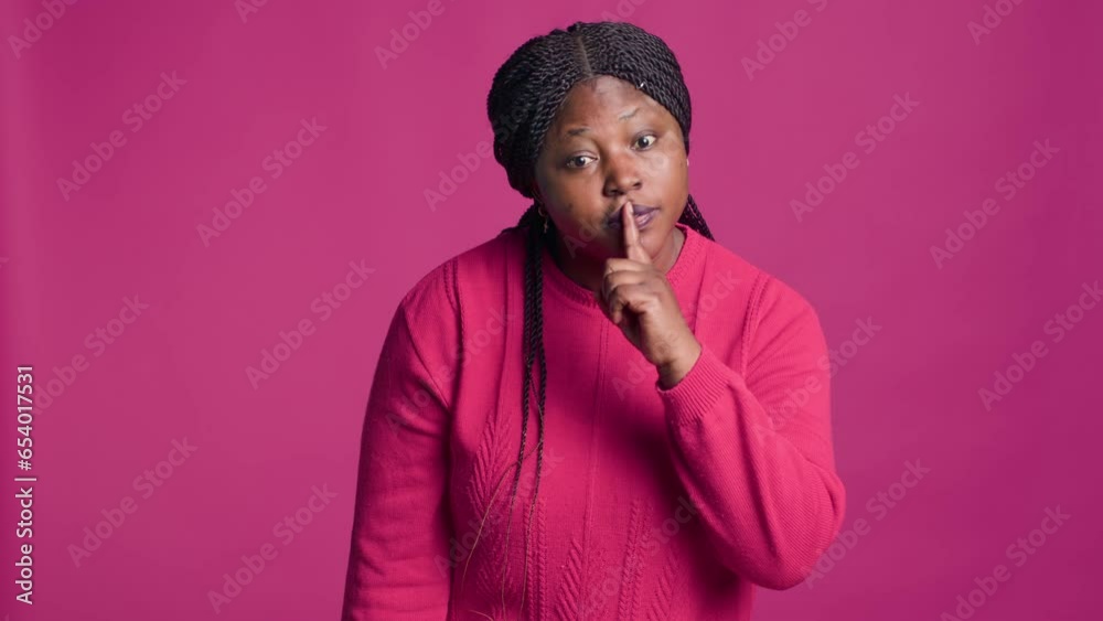 African american woman standing in front of isolated background ...