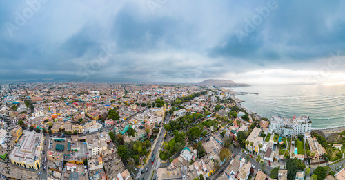 Panoramic aerial image of the Barranco neighborhood in Lima, Peru. Next to the Pacific Ocean with its houses, businesses and bohemian appeal. Image from 2023.