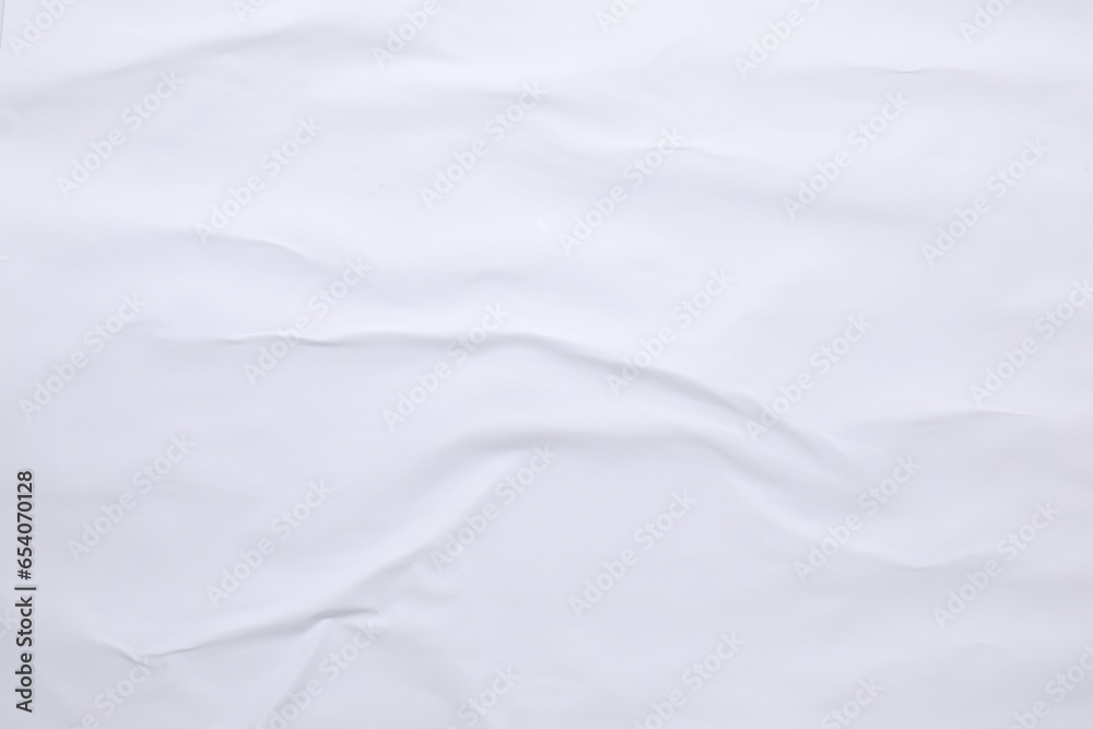 White crumpled sheet of paper as background, top view. Wall poster White crumpled sheet of paper as background, top view. Wall poster