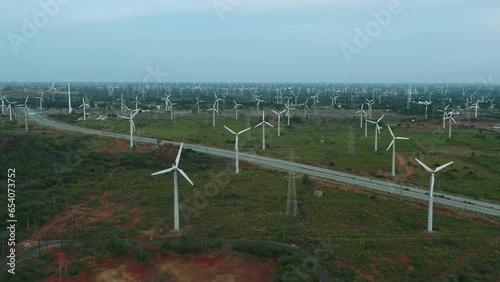 Beautiful view of Windmills or Wind Turbines farm in Nagercoil at Kanyakumari , South India_ and highwayroad photo