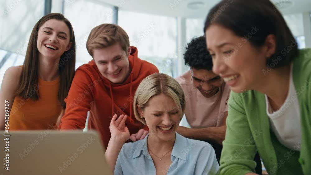 Startup agency team laughing laptop at workplace closeup. Happy group having fun