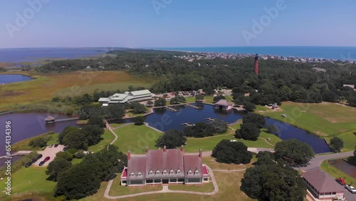 Aerial Drone Shot of Currituck Lighthouse, Outer Banks Center for Wildlife Education, Whalehead Club and Historic Corolla Park. photo