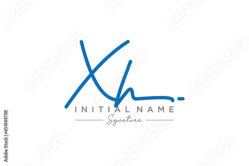 Initial XH signature logo template vector. Hand drawn Calligraphy lettering Vector illustration. photo