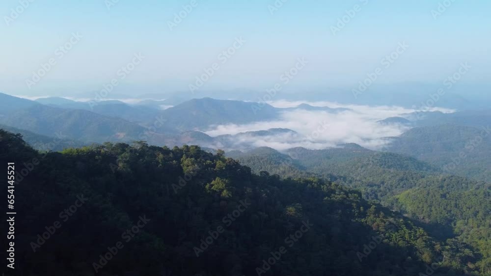 Beautiful late morning with the mist and the gentle rays of the sun under a clear and tranquil sky at a mountain in Chiang Mai, Thailand. Beautiful late morning with the mist and the gentle rays of the sun under a clear and tranquil sky at a mountain in Chiang Mai, Thailand.