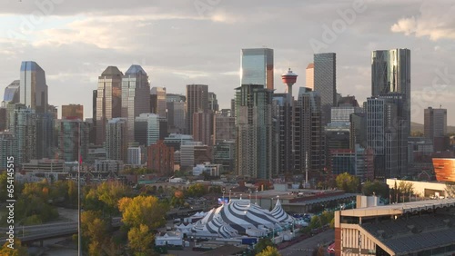 The downtown core of Calgary Alberta is seen from a aerial drone point of view with the Stampede grounds in the foreground photo