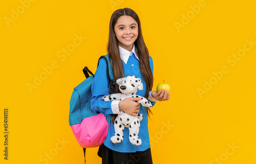 college student girl. teen girl gets high education. education in school. teen girl hold toy of her childhood. study at college. back to school. childhood and education. before the leasson photo