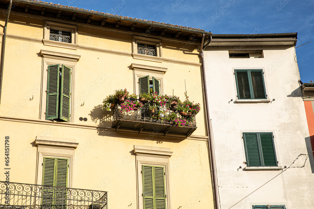Beautiful italian facade of a house, sunshine lights.