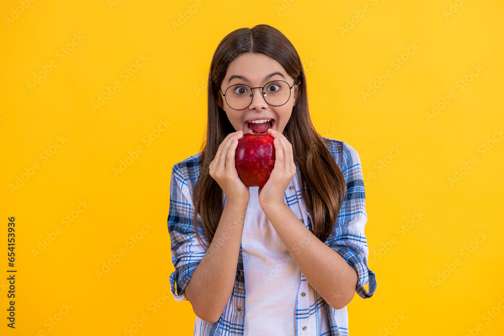 Biting apple concept. Healthy apple fruit. natural vitamin for teen girl. teen child with apple. healthy food. teen girl eating apple. girl has breakfast with vitamin. dieting and vegan. Fresh fruit