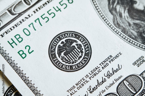 macro photo of federal reserve system symbol on hundred dollar bill. shallow focus. close-up with fine and sharp texture