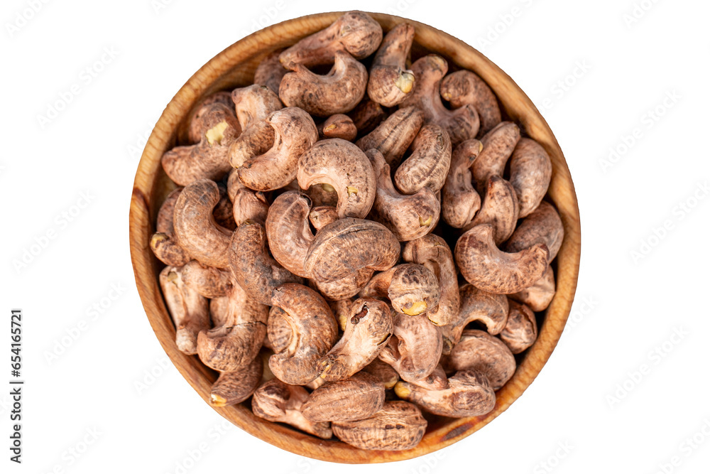 Cashews with shell in wood bowl. Shelled cashew isolated on white background. Top view Cashews with shell in wood bowl. Shelled cashew isolated on white background. Top view