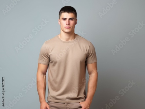 Handsome Fictional White Male Model in Casual Clothes Posing on a Plain Neutral Background. Attractuve Muscular and Confident Person Portrait. Generative AI. photo