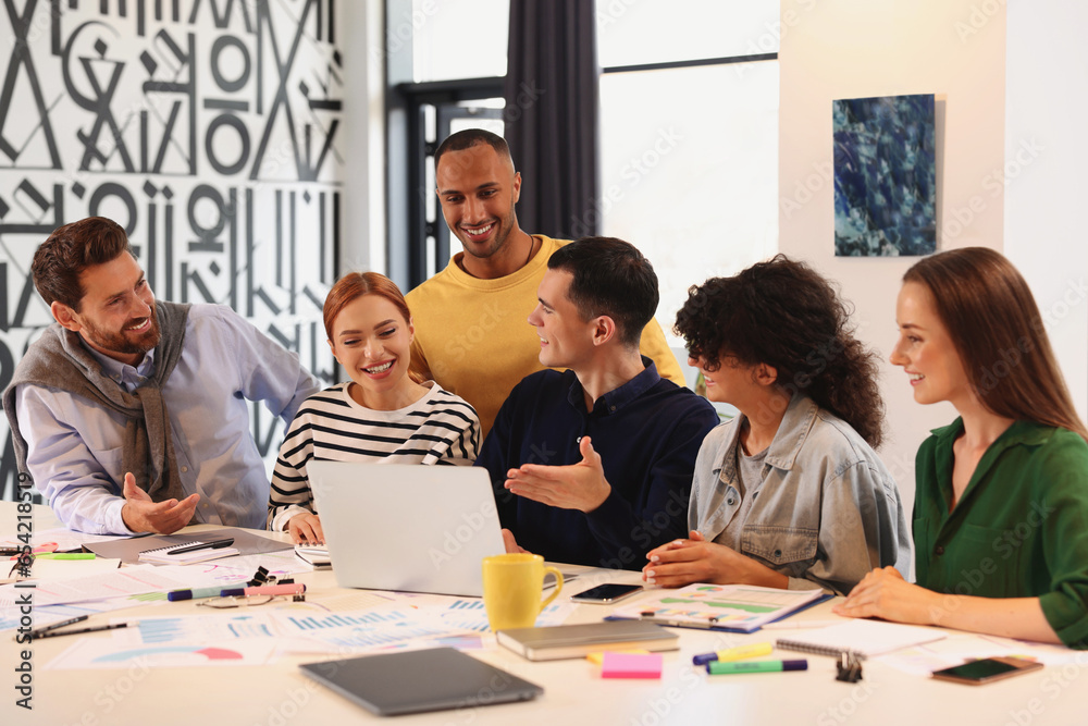 Team of employees working together at table in office. Startup project Team of employees working together at table in office. Startup project