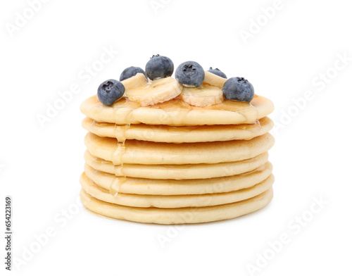 Delicious pancakes with banana slices, blueberries and honey isolated on white