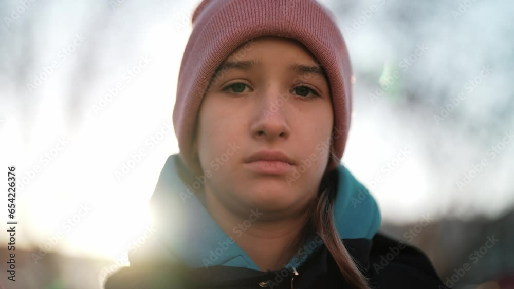 Young caucasian beautiful sad girl looks at camera. Emotions sadness, depression, unhealthy and tired facial expression of model. Serious problems of teenagers. Psychology help on mental health. Young caucasian beautiful sad girl looks at camera. Emotions sadness, depression, unhealthy and tired facial expression of model. Serious problems of teenagers. Psychology help on mental health.