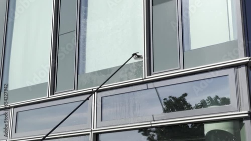 Exterior cleaning or window cleaning of a facade with a Water-fed pole