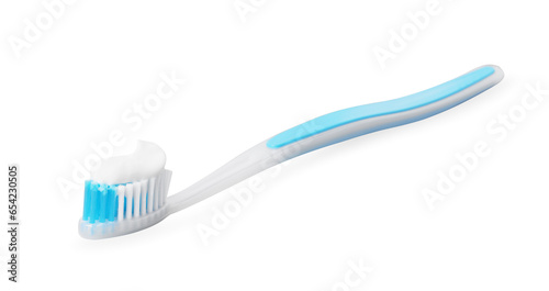 Plastic toothbrush with paste on grey background