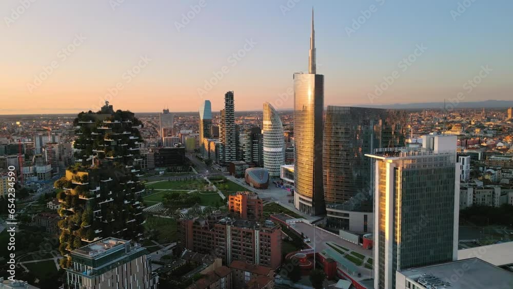 aerial view drone milan city business district at sunrise pan,modern town financial area at dawn panning