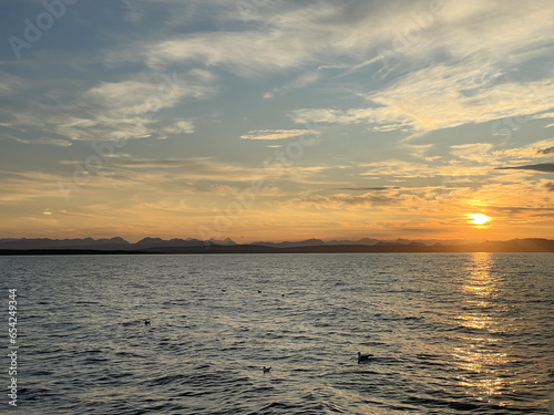 Landscape Long exposure of majestic clouds in the sky sunset or sunrise over sea with reflection in the tropical sea.Beautiful cloudscape scenery.Amazing light of nature Landscape nature background