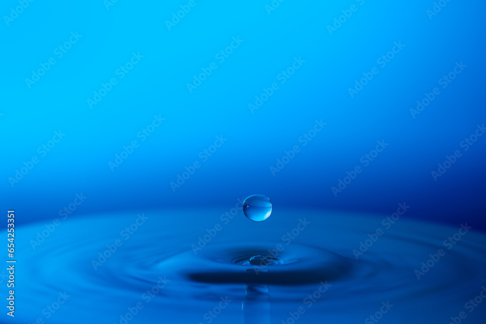 Droplet of Water on a Blue Background Droplet of Water on a Blue Background