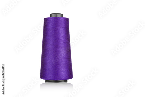 Photography spool of industrial threads purple colors, texture of threads on a white backgro